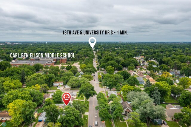 1709 13th Ave S, Fargo, ND 58103 - aerial perspective of suburban area featuring a forest