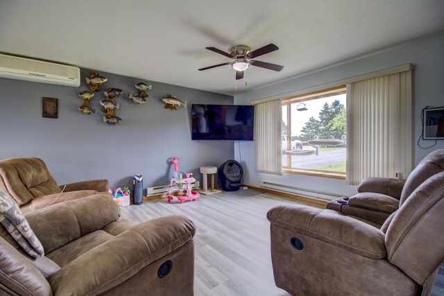 111 W Ave, Ottertail, MN 56571 - living area featuring a wall mounted AC, ceiling fan, a baseboard radiator, and wood finished floors