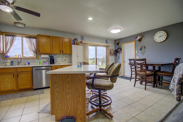 111 W Ave, Ottertail, MN 56571 - kitchen featuring stainless steel dishwasher, plenty of natural light, light countertops, ceiling fan, and recessed lighting