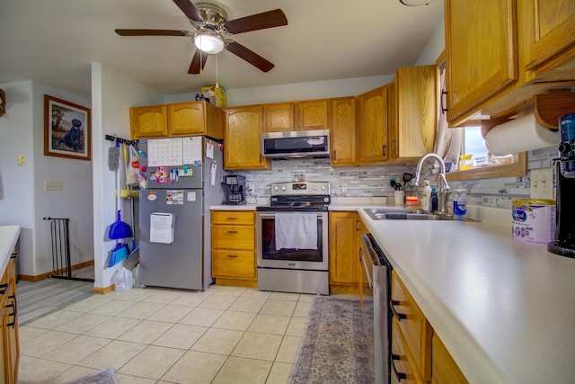111 W Ave, Ottertail, MN 56571 - kitchen with appliances with stainless steel finishes, light tile patterned floors, backsplash, and ceiling fan