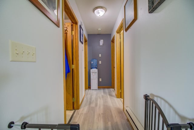 111 W Ave, Ottertail, MN 56571 - corridor featuring light wood-style flooring and a baseboard heating unit