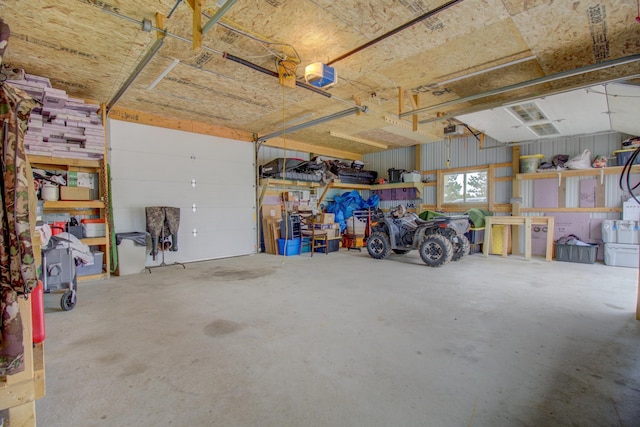 111 W Ave, Ottertail, MN 56571 - garage featuring a garage door opener