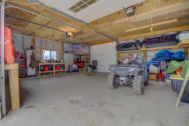 111 W Ave, Ottertail, MN 56571 - garage featuring a garage door opener