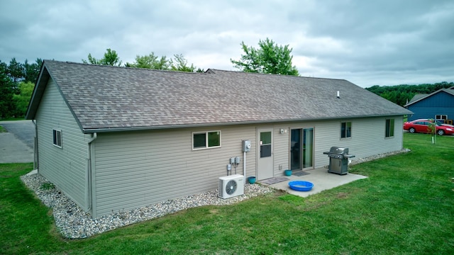 111 W Ave, Ottertail, MN 56571 - rear view of house with a lawn, a patio area, and a shingled roof