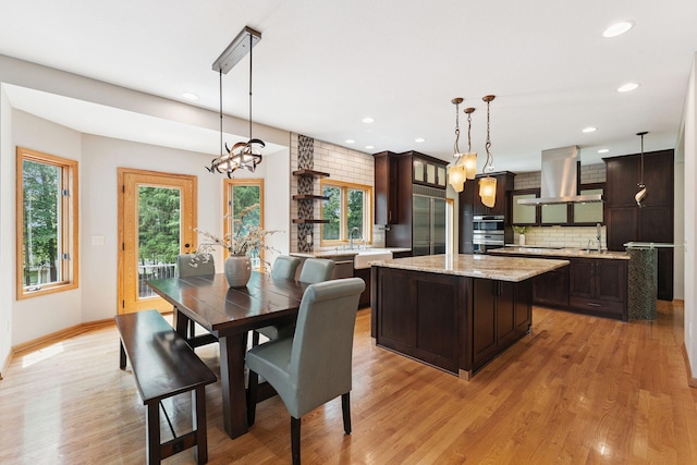 5401 River Oak Dr, Savage, MN 55378 - dining room with light wood-style flooring, a chandelier, and recessed lighting