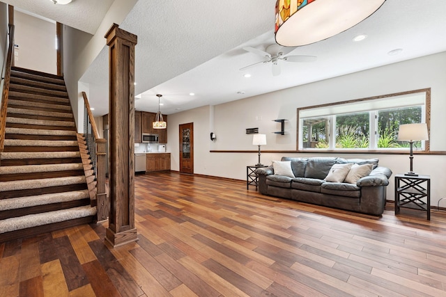 5401 River Oak Dr, Savage, MN 55378 - living room featuring wood finished floors, ceiling fan, stairs, and recessed lighting