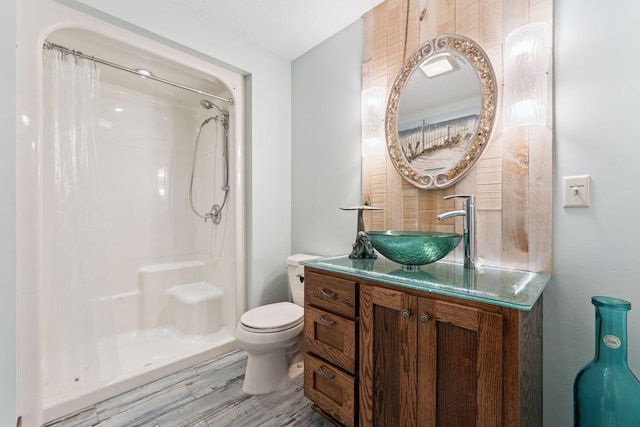 5401 River Oak Dr, Savage, MN 55378 - bathroom featuring vanity, wood finished floors, and a shower with shower curtain