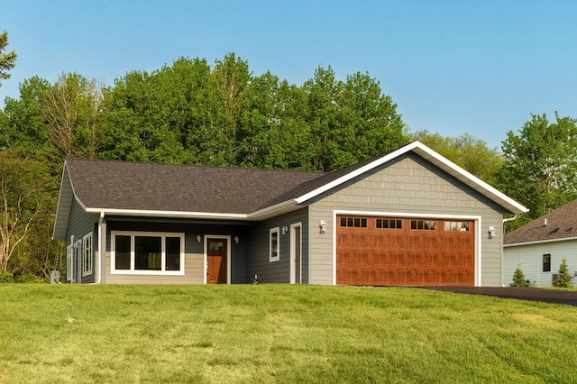 3829 Stebner Rd, Hermantown, MN 55811 - single story home with a front yard, a garage, and a shingled roof