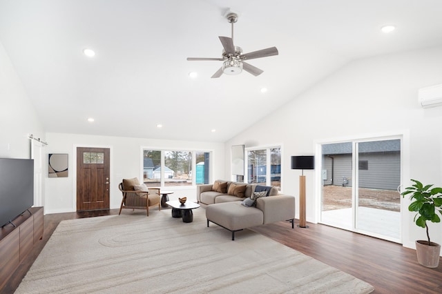 3829 Stebner Rd, Hermantown, MN 55811 - living room featuring dark wood-style flooring, recessed lighting, high vaulted ceiling, a ceiling fan, and a wall mounted air conditioner