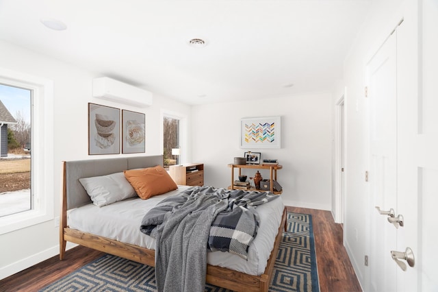 3829 Stebner Rd, Hermantown, MN 55811 - bedroom with an AC wall unit and wood finished floors