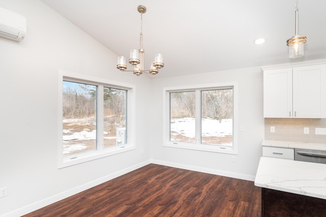 3829 Stebner Rd, Hermantown, MN 55811 - unfurnished dining area featuring a wall mounted air conditioner, dark wood-style floors, a chandelier, healthy amount of natural light, and recessed lighting