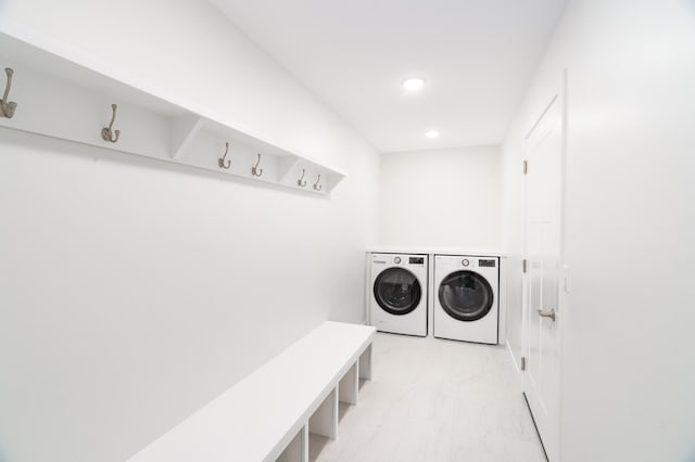 3829 Stebner Rd, Hermantown, MN 55811 - laundry area with washing machine and dryer, light marble finish flooring, and recessed lighting