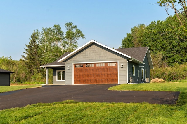 3829 Stebner Rd, Hermantown, MN 55811 - view of front of house with an attached garage, driveway, and a front yard