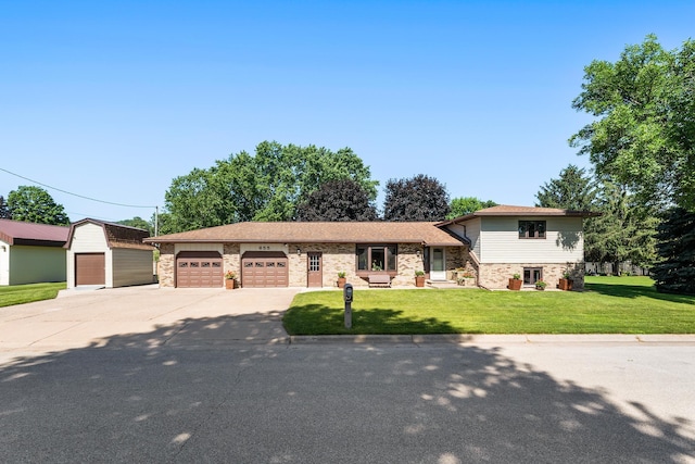 655 48th Ave, Goodview, MN 55987 - split level home featuring driveway, a front yard, a garage, and stone siding