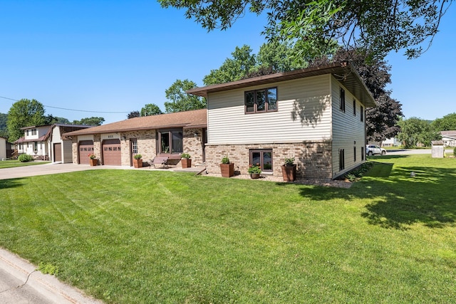 655 48th Ave, Goodview, MN 55987 - split level home with a garage, concrete driveway, a front lawn, and brick siding