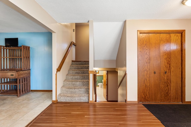 655 48th Ave, Goodview, MN 55987 - stairway featuring wood finished floors and baseboards