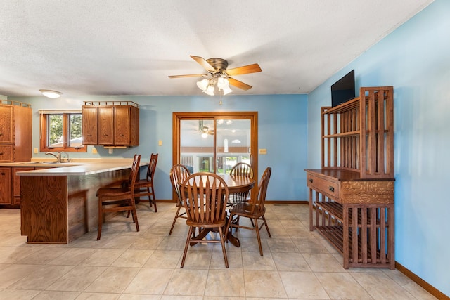 655 48th Ave, Goodview, MN 55987 - dining space with a ceiling fan and a textured ceiling