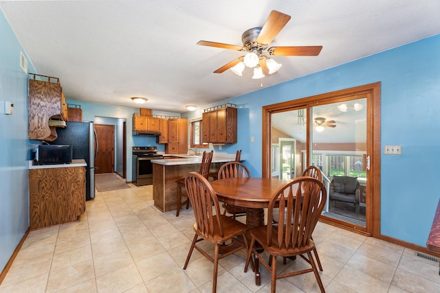 655 48th Ave, Goodview, MN 55987 - dining space featuring ceiling fan and plenty of natural light