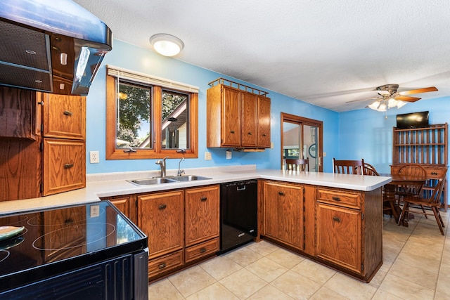 655 48th Ave, Goodview, MN 55987 - kitchen featuring black appliances, a peninsula, brown cabinets, light countertops, and a textured ceiling