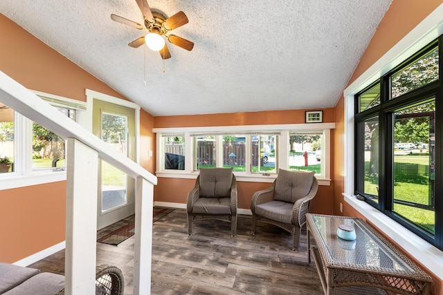 655 48th Ave, Goodview, MN 55987 - sunroom with vaulted ceiling, a textured ceiling, and wood finished floors