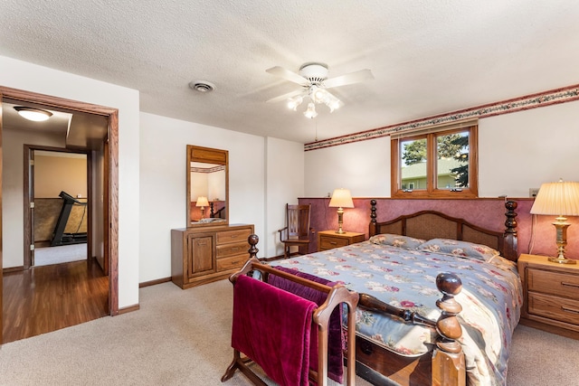 655 48th Ave, Goodview, MN 55987 - bedroom featuring carpet flooring, ceiling fan, and a textured ceiling