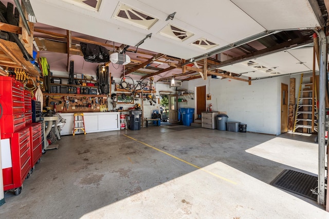 655 48th Ave, Goodview, MN 55987 - garage featuring a workshop area and a garage door opener