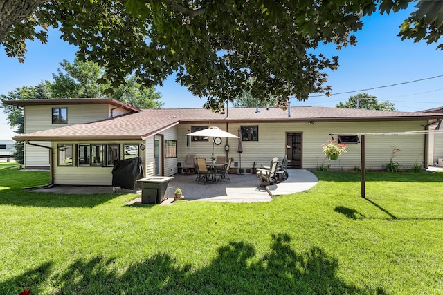 655 48th Ave, Goodview, MN 55987 - back of house featuring a patio, a yard, and roof with shingles