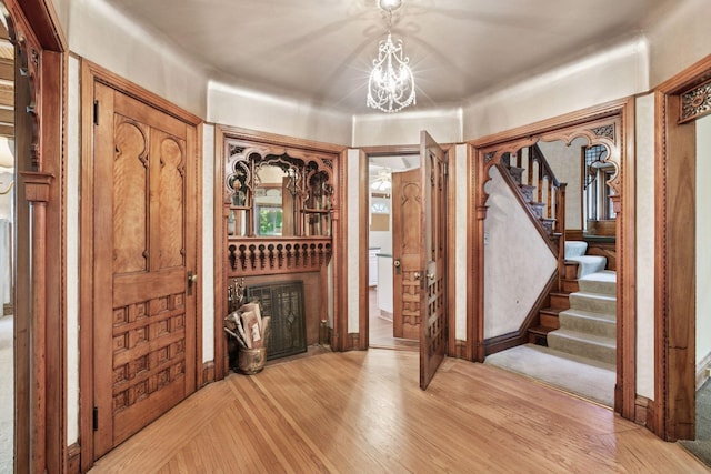 1323 Keston St, Saint Paul, MN 55108 - entryway with stairs, a chandelier, and light wood finished floors