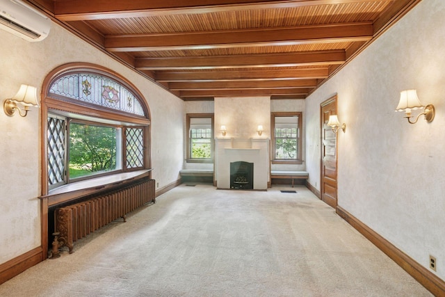 1323 Keston St, Saint Paul, MN 55108 - unfurnished living room with radiator, a wall mounted air conditioner, carpet floors, a wood ceiling with exposed beams, and a large fireplace