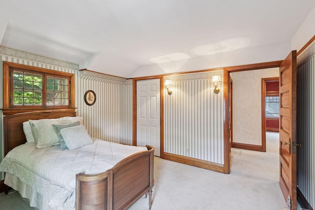 1323 Keston St, Saint Paul, MN 55108 - bedroom with light colored carpet, lofted ceiling, and a closet