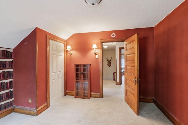 1323 Keston St, Saint Paul, MN 55108 - hallway featuring carpet floors and vaulted ceiling