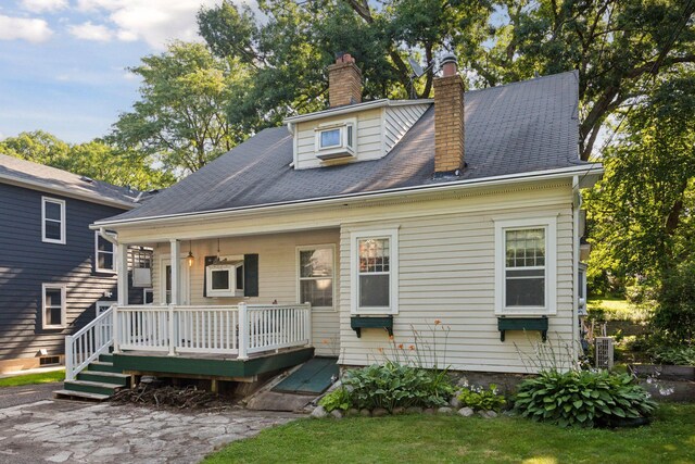 1323 Keston St, Saint Paul, MN 55108 - view of front of home featuring a chimney and a deck