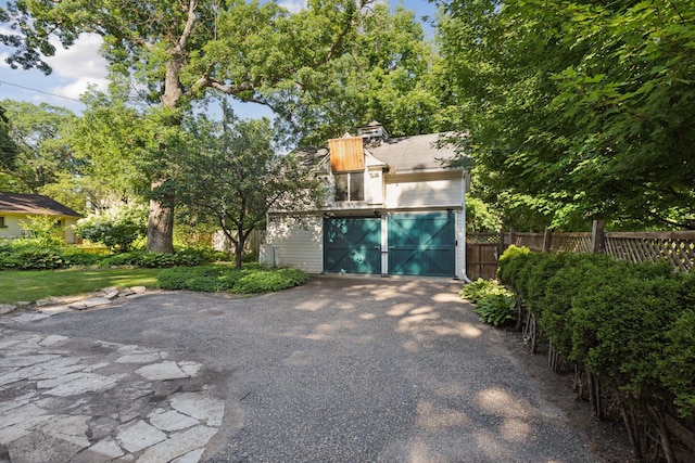 1323 Keston St, Saint Paul, MN 55108 - detached garage featuring asphalt driveway