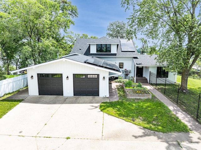 4255 County Road 11 NE, Alexandria, MN 56308 - modern farmhouse featuring roof with shingles, driveway, solar panels, and a garage