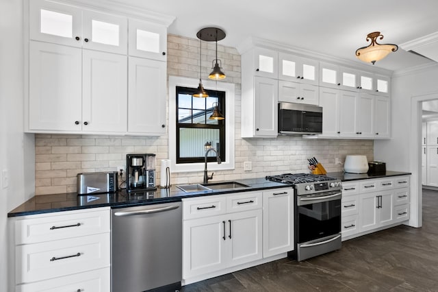 4255 County Road 11 NE, Alexandria, MN 56308 - kitchen featuring appliances with stainless steel finishes, dark countertops, ornamental molding, backsplash, and white cabinetry