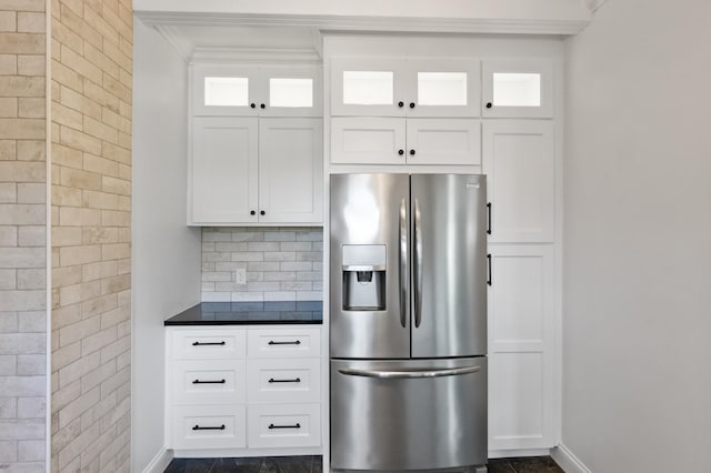 4255 County Road 11 NE, Alexandria, MN 56308 - kitchen with stainless steel refrigerator with ice dispenser, dark countertops, crown molding, glass insert cabinets, and white cabinets