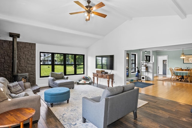 4255 County Road 11 NE, Alexandria, MN 56308 - living room featuring beamed ceiling, a wood stove, wood finished floors, ceiling fan, and high vaulted ceiling