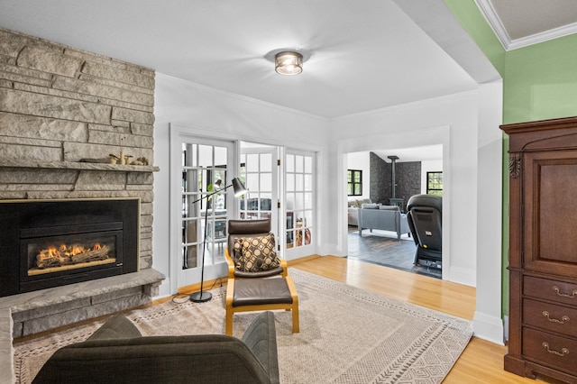 4255 County Road 11 NE, Alexandria, MN 56308 - living area with light wood finished floors, crown molding, and a stone fireplace