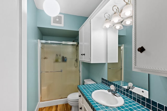 4255 County Road 11 NE, Alexandria, MN 56308 - full bath featuring a shower stall, vanity, and wood finished floors