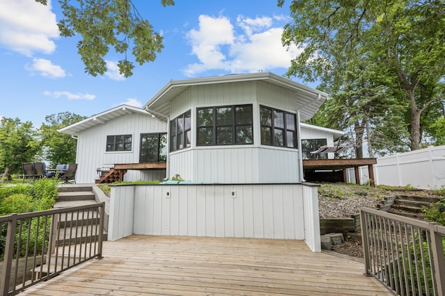 4255 County Road 11 NE, Alexandria, MN 56308 - rear view of property featuring a deck, a sunroom, and stairway