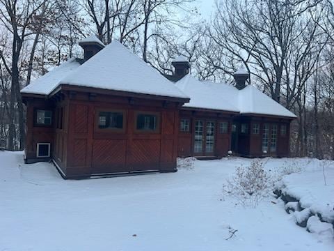 2700 Olde Wood Ct, Minnetonka, MN 55391 - snow covered property featuring a chimney