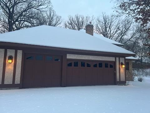 2700 Olde Wood Ct, Minnetonka, MN 55391 - view of snow covered garage