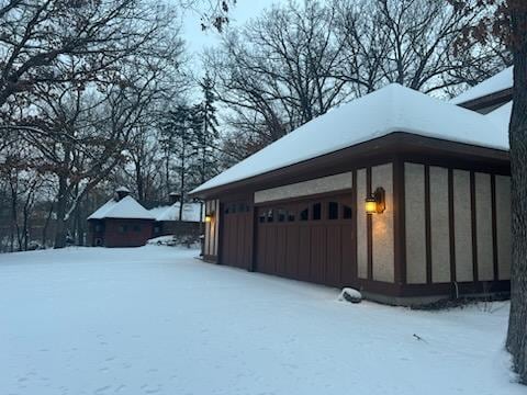 2700 Olde Wood Ct, Minnetonka, MN 55391 - snow covered garage with a garage
