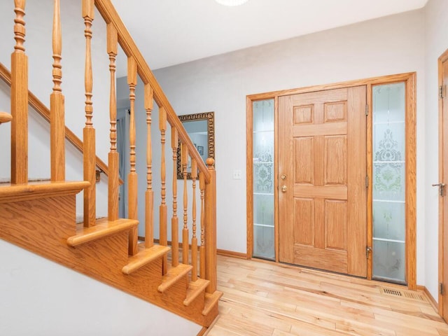 1632 Seashell Ln, Waconia, MN 55387 - entryway with wood finished floors and stairs