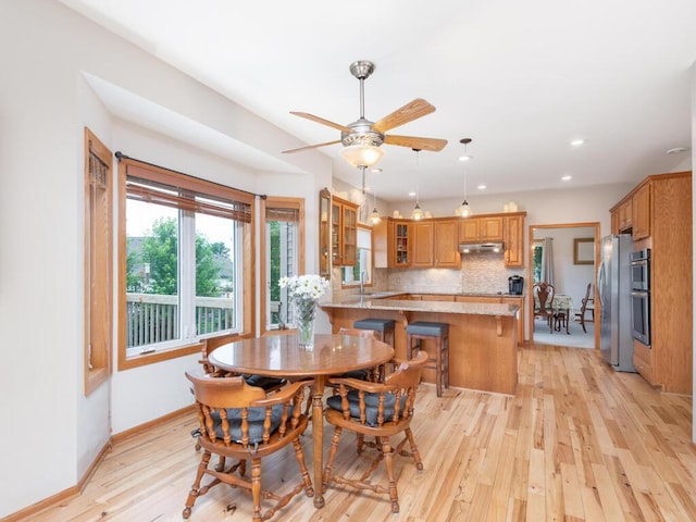 1632 Seashell Ln, Waconia, MN 55387 - dining space with light wood-type flooring, ceiling fan, and recessed lighting
