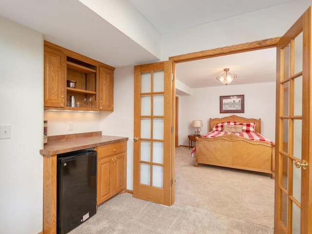 1632 Seashell Ln, Waconia, MN 55387 - bedroom with refrigerator, light colored carpet, a bar, and french doors