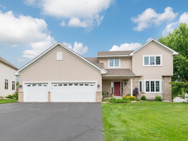 1632 Seashell Ln, Waconia, MN 55387 - traditional-style house with asphalt driveway, brick siding, a front yard, an attached garage, and a shingled roof