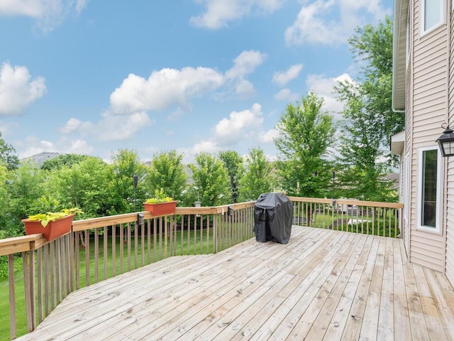 1632 Seashell Ln, Waconia, MN 55387 - wooden terrace with area for grilling and view of scattered trees