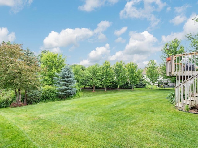 1632 Seashell Ln, Waconia, MN 55387 - view of grassy yard featuring stairs, a deck, and golf course view