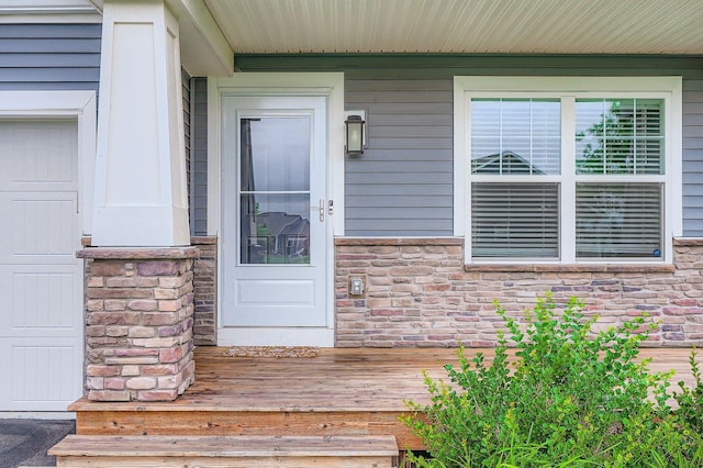 1221 136th St W, Rosemount, MN 55068 - property entrance featuring stone siding and a porch